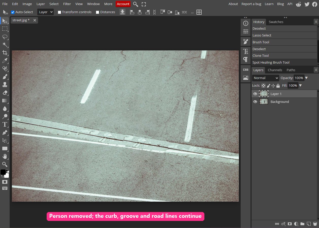 The finished street: the man is removed and the curb, groove and road lines run continuously across the frame